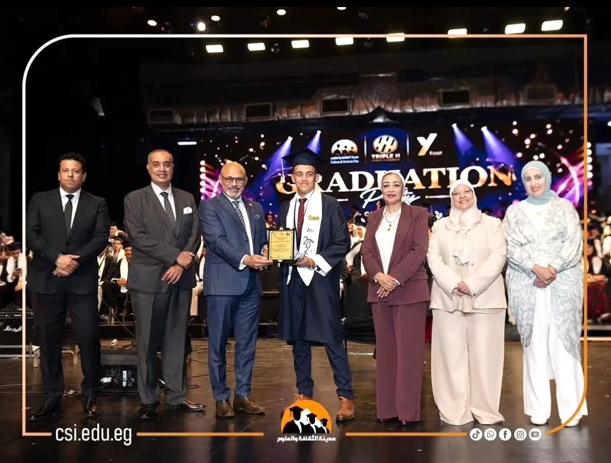 Presenting an award to a graduate during the ceremony